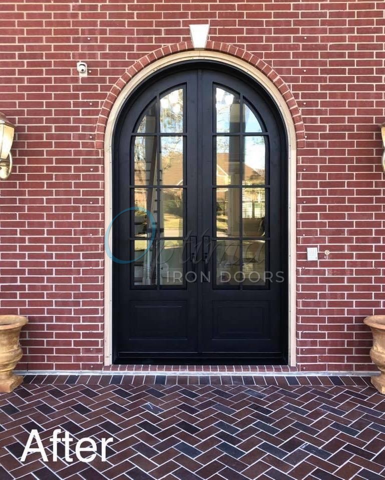 Iron entry doors on a brick home